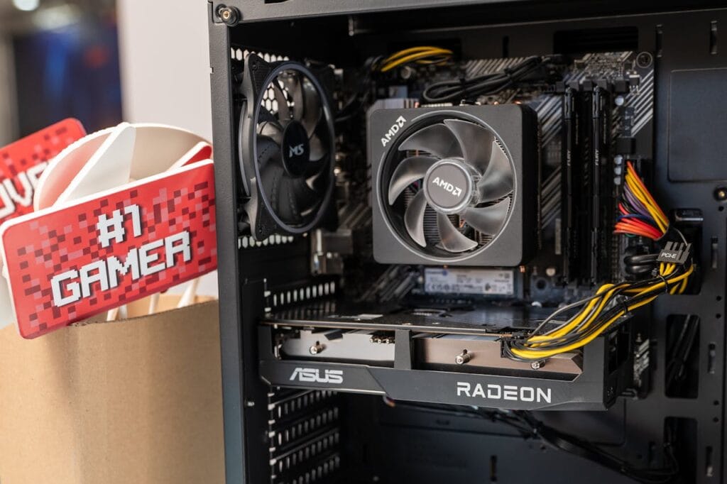 Close-up of gaming computer interior with cooling fan and graphics card.
